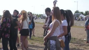 ST. PETERSBURG, RUSSIA - JULY 18, 2015: VK FEST. Girls and boys dancing on summer beach disco music dj