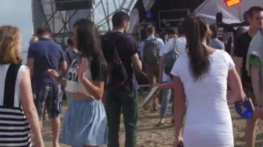 ST. PETERSBURG, RUSSIA - JULY 18, 2015: VK FEST. Girls and boys dancing on summer beach disco music dj
