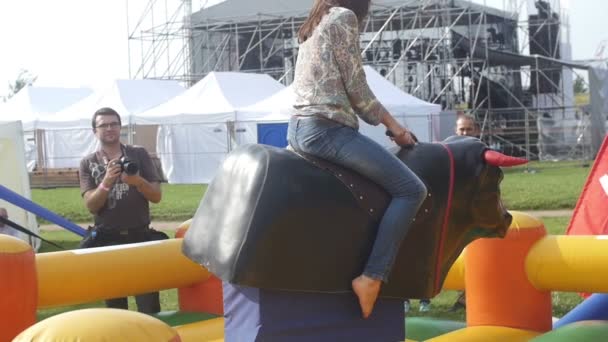 ST. PETERSBURG, RUSSIA - JULY 18, 2015: VK FEST. Riding a mechanical bull. Slow motion — Stock Video