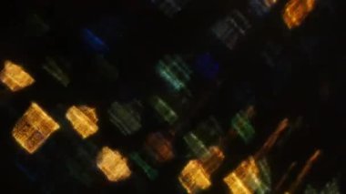 Siyah arka plan üzerine soyut ışıklar bokeh. Şekil