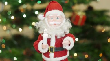 Arka plan bokeh, oyuncak Noel Baba selamlar