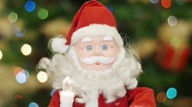 Arka plan bokeh, oyuncak Noel Baba selamlar