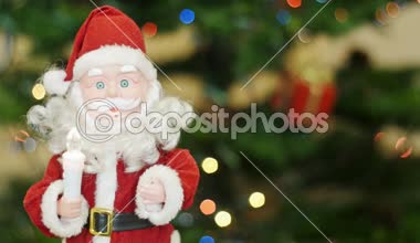 Arka plan bokeh, oyuncak Noel Baba selamlar