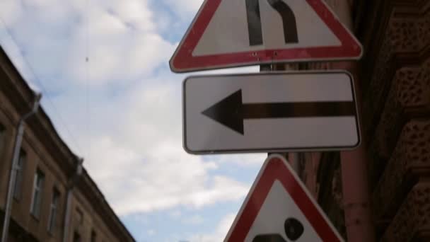 Road warnings signs on the street focus in in summer evening. Pan vertical — Stock Video