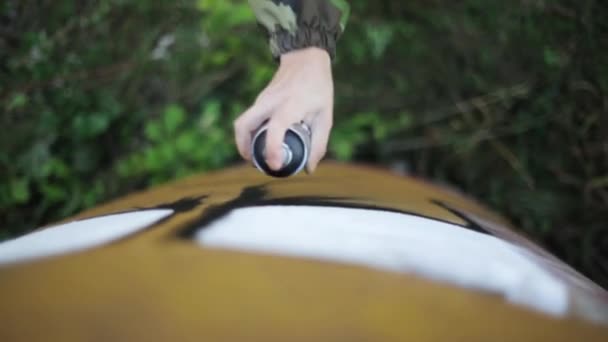 Mans hand paint spraying graffiti on the wall. Summer day. Top view. Vandalism — Stock Video