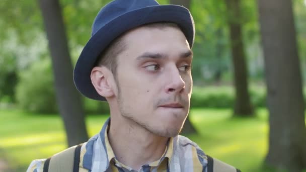 Portrait of boy in hat demonstrate waiting. Nervous. Outdoor. Summer — Stock Video