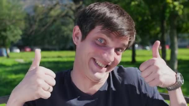 Positive young man showing thumbs up — Αρχείο Βίντεο