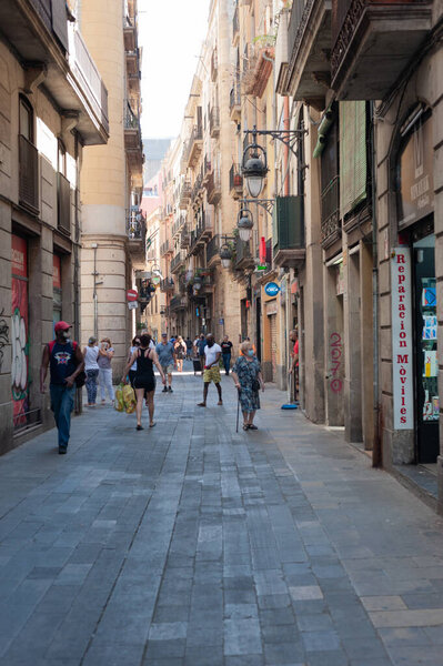 Barcelona, Spain; 19th July 2021: Commercial street in the center of Barcelona with people walking, in full rise in the incidence of cases by COVID-19 of the fifth wave. With curfew in the hostelry.