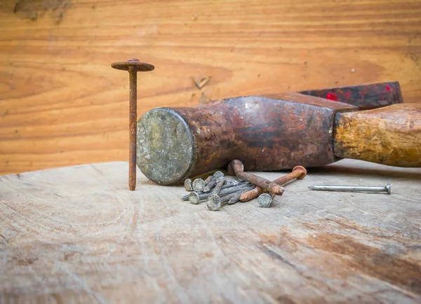 stock image Old hammer and nails on the wood