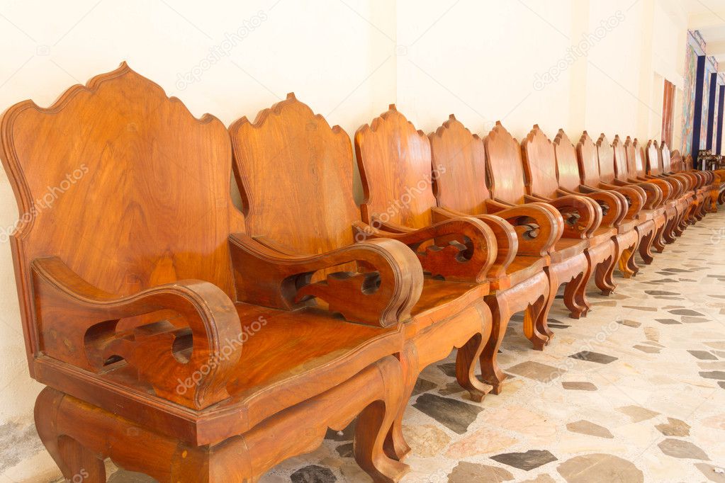 Row wooden chair on the floor.