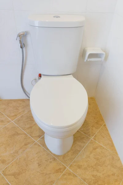 White toilet bowl in a bathroom — Stock Photo, Image