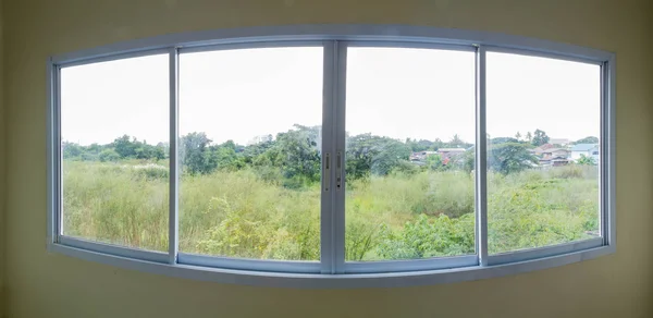 Panorama of overlooking view from building glass windows on white aluminum frames
