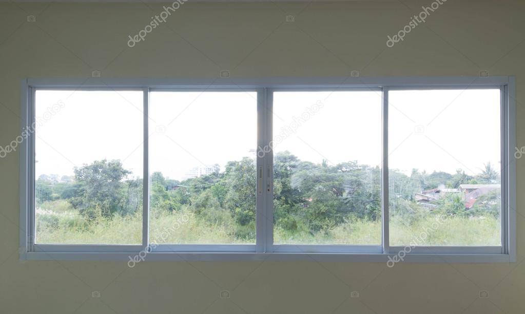 Overlooking view from building glass windows on white aluminum frames