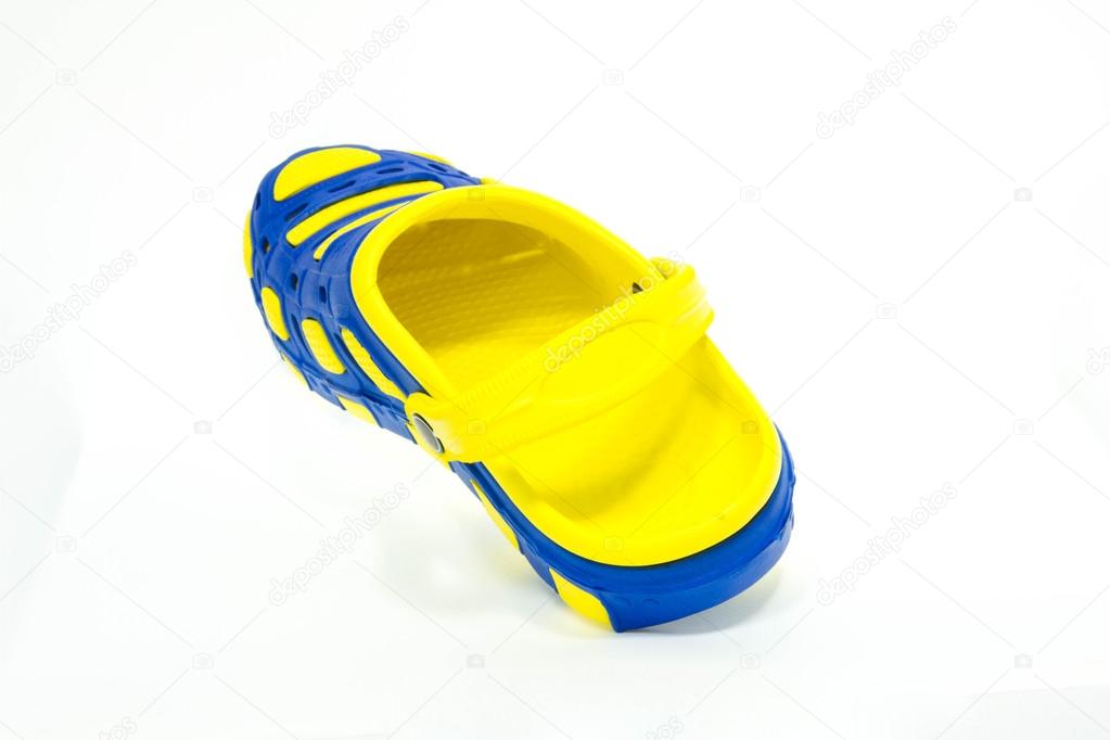 Blue and yellow rubber sandals on a white background