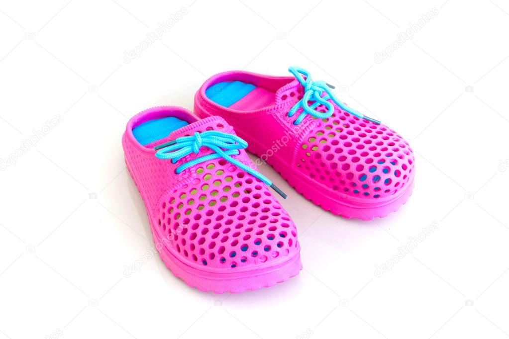 Colorful of pink rubber sandals on a white background