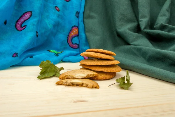 Macaroons homemade stacked and dry leaves currants