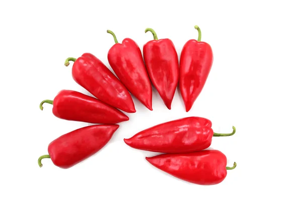 Eight bright red sweet peppers on a white background — Stock Photo, Image