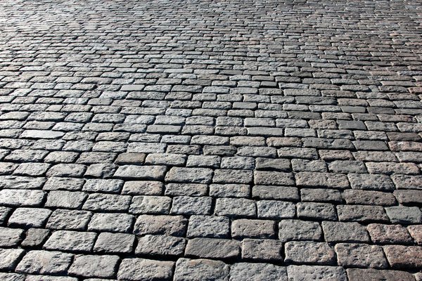 pavement made of stone in sunlight and backlit conditions