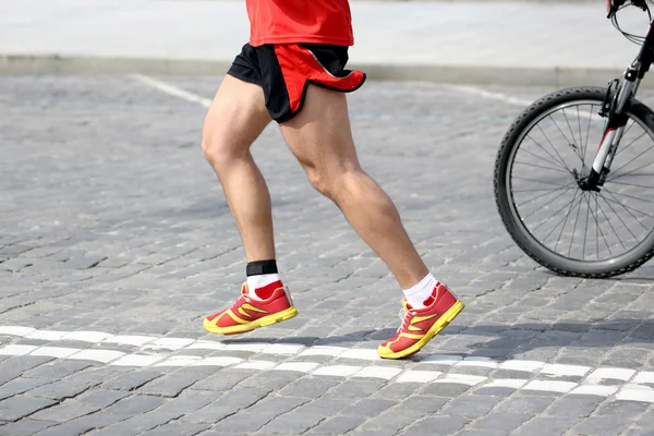 Feet running athlete on the course — Stock Photo, Image