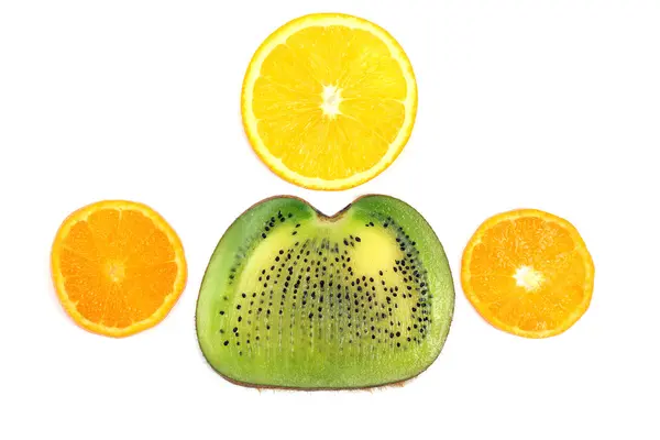 Cortar a través de diferentes frutas sobre fondo blanco — Foto de Stock