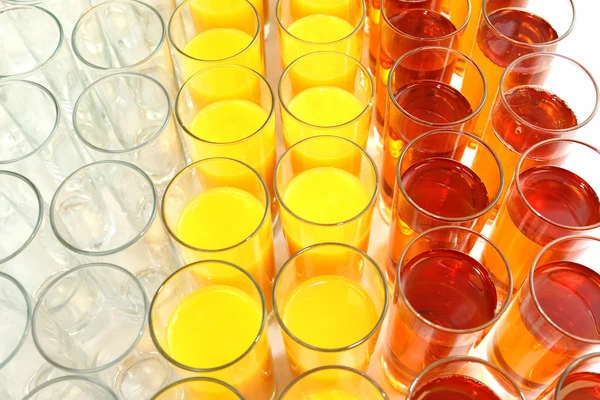 Many glasses with different juice — Stock Photo, Image