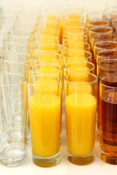 Many glasses with different juice — Stock Photo, Image