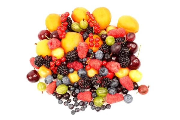 Lots of fresh different berries on a white background — Stock Photo, Image