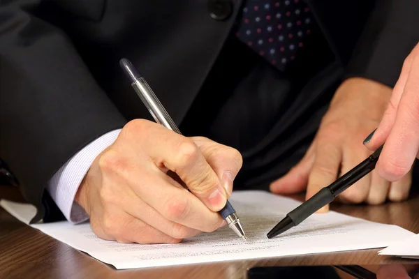 Hands of business men and women studying the documents — Stock Photo, Image