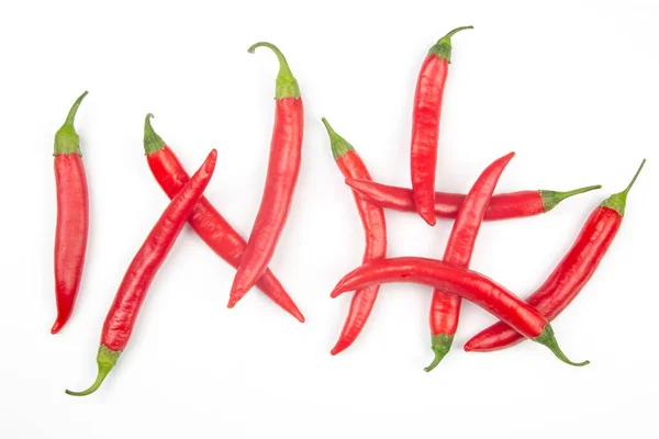Κόκκινες Καυτερές Πιπεριές Τσίλι Λευκό Φόντο Φιγούρες Φυτικές Τροφές Βιταμινών — Φωτογραφία Αρχείου