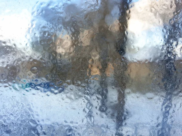 frosty patterns on the window glass closeup. natural textures and backgrounds. ice patterns on frozen