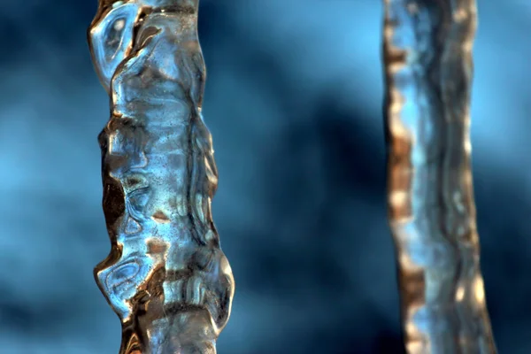 Transparent icicle close up against the sky — Stock Photo, Image