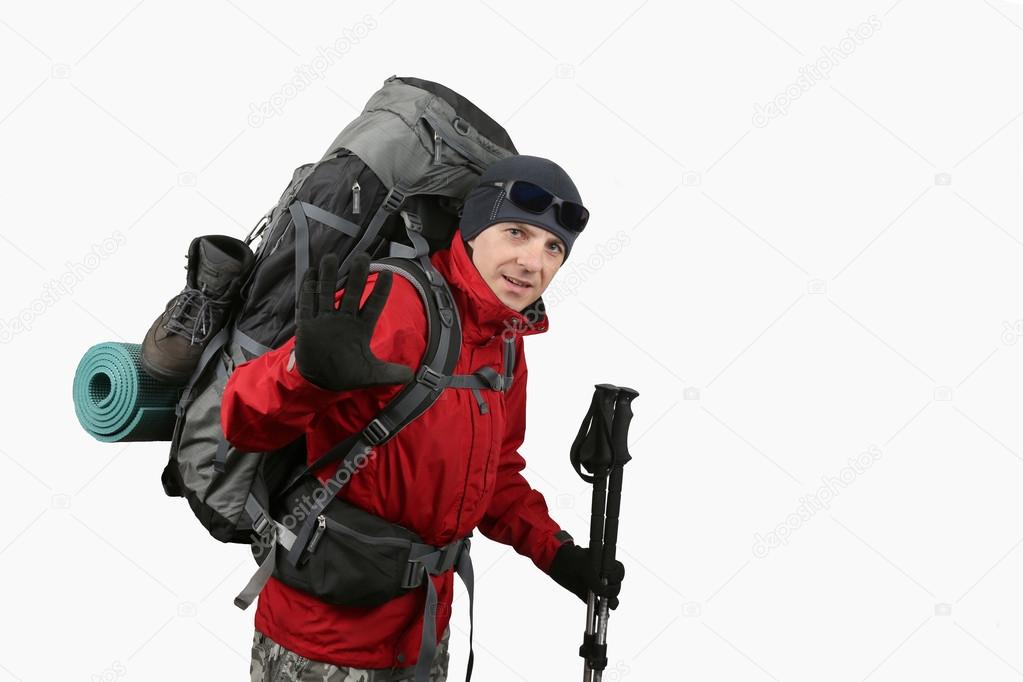 Happy equipped traveler in red jacket isolated on a white backgr