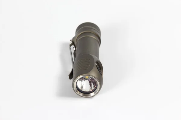 Mały szary latarka metal na białym tle — Zdjęcie stockowe