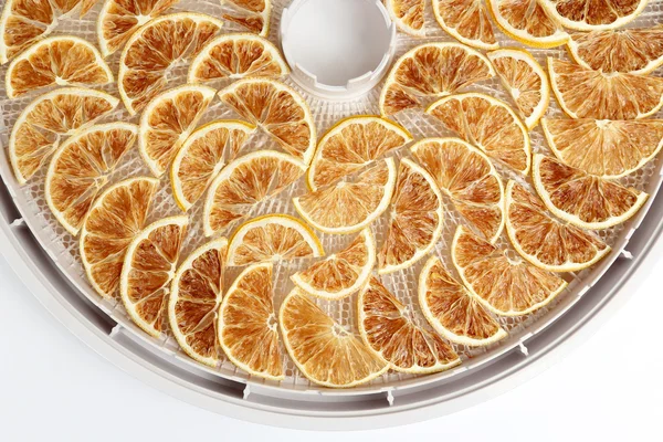 dried lemon slices on the tray dryers