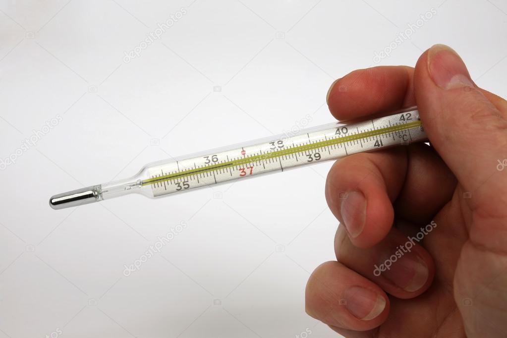 hand with medical thermometer close up