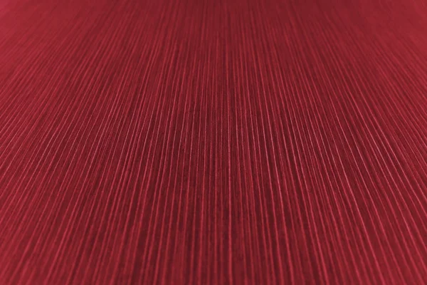 La textura del papel rayado en un tono rojo — Foto de Stock