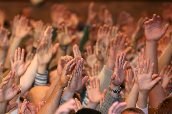 Raised up a human hands at the event — Stock Photo, Image