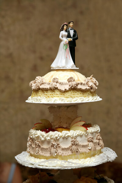 decorative pair of newlyweds on top of a wedding cake