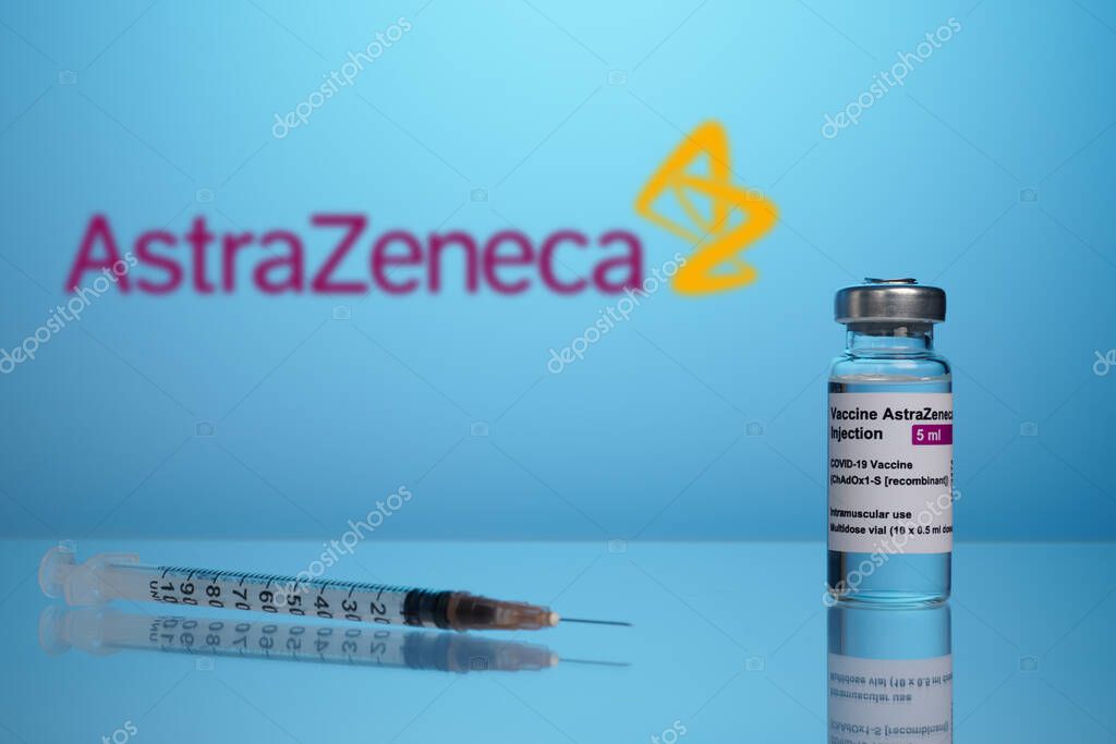 Krasnoyarsk, Russia. April 17, 2021. AstraZeneca Covid vaccine vial with syringe ready for inoculation. Covid treatment illustrative editorial photo for health care propaganda. Vaccine remedy made by
