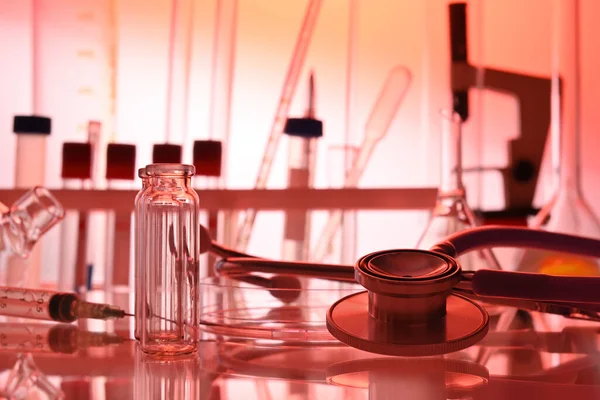 Medical Lab Table with Chemical Glassware and Stethoscope