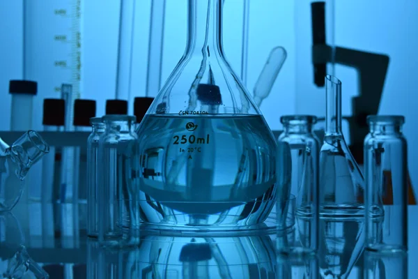 Chemical Glassware Equipment in Science Laboratory in Blue Colors — Stock Photo, Image