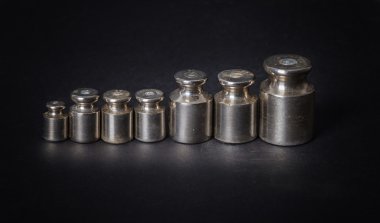 a set of small metal weights clipart