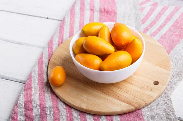 Kumquats White Plate White Wooden Background Close — Stock Photo, Image