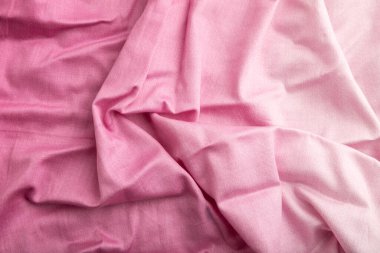 Pamuk mor bir doku parçası. Üst görünüm, doğal tekstil arka plan ve doku. dalga konsepti, soyut.