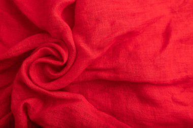 Kırmızı ipek doku parçası. Üst manzara, düz döşeme, doğal tekstil arka plan ve doku. dalga konsepti, soyut, sarmal biçim.