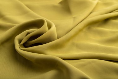 Yeşil zeytin ipeği dokusu. Yan görünüş, doğal tekstil arka plan ve doku. dalga konsepti, soyut, sarmal biçim.