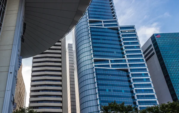 Part of modern  building and blue glass skyscapers — Stockfoto