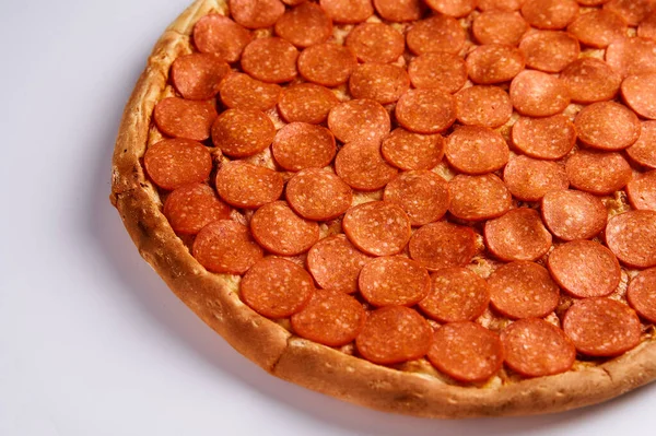 Pizza with sausages pepperoni on a white background. Top view.Very high quality photo. — Stock Photo, Image