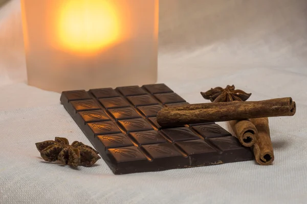 Chocolate, cinnamon sticks and star anise — Stock Photo, Image