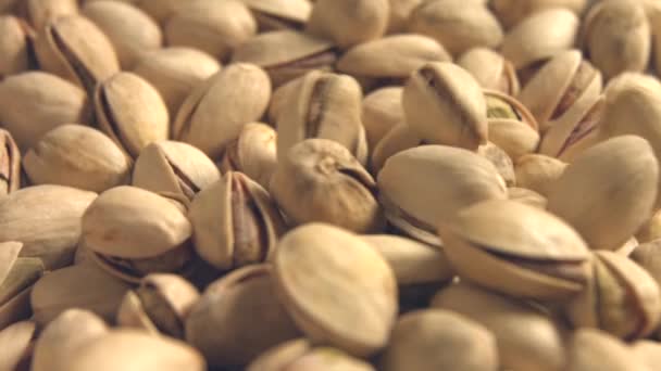 Pistachios. 2 Shots. Slow motion. Vertical and horizontal pan. Close-up. — Stock Video